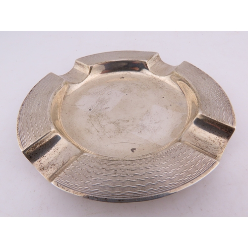 125 - A Mappin & Webb sterling silver ashtray, Birmingham 1924, of circular form with engine-turned decora... 