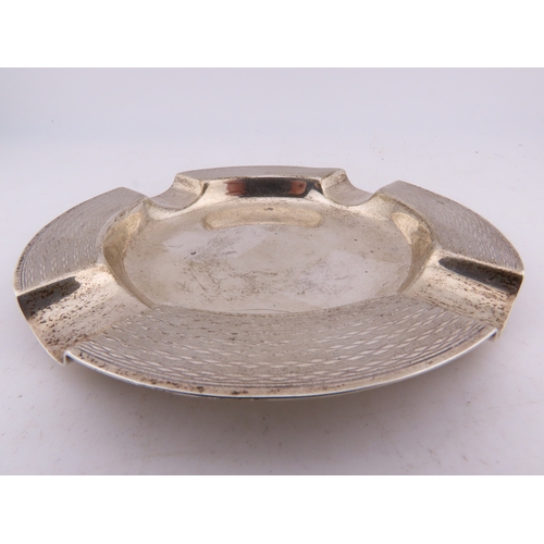 125 - A Mappin & Webb sterling silver ashtray, Birmingham 1924, of circular form with engine-turned decora... 