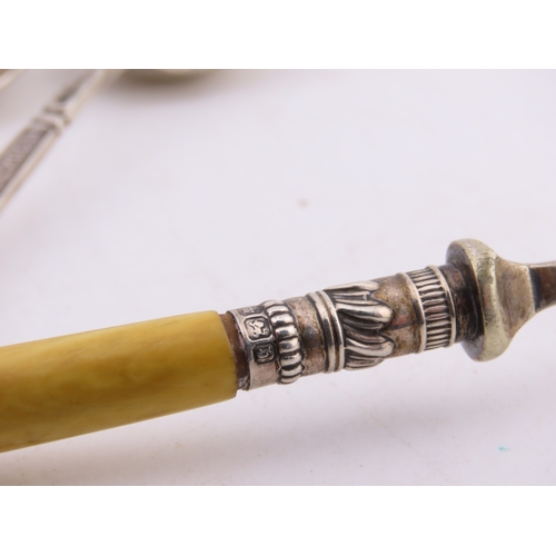 129 - A group of five Sheffield-hallmarked souvenir teaspoons, each with ornate cast terminals depicting c... 