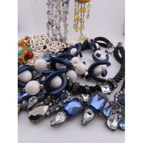 83 - Collection of necklaces A substantial group of costume necklaces comprising faceted bead strands, fl... 