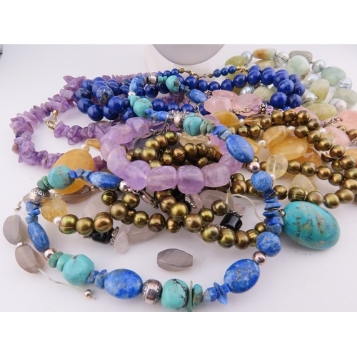 95 - A group of semi-precious stone necklaces, including amethyst, turquoise, lapis lazuli, quartz, agate... 