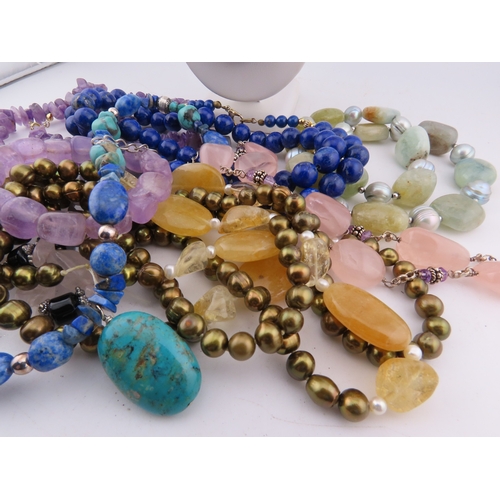 95 - A group of semi-precious stone necklaces, including amethyst, turquoise, lapis lazuli, quartz, agate... 