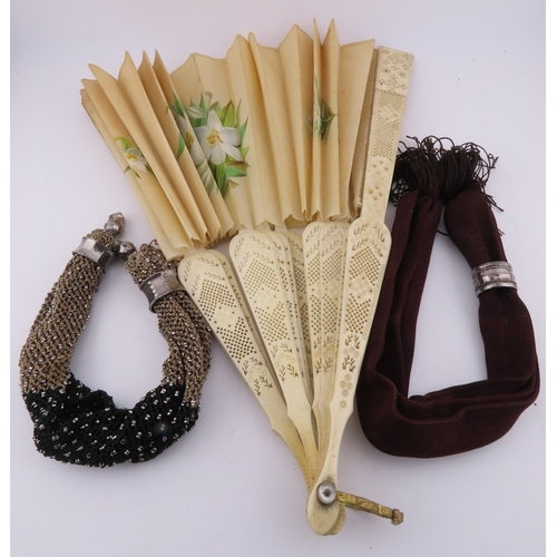 132 - Two Victorian misers purses and a vintage fan, A charming group comprising two Victorian misers purs... 