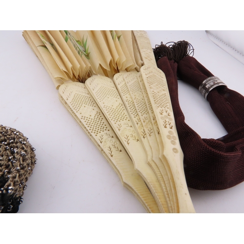 132 - Two Victorian misers purses and a vintage fan, A charming group comprising two Victorian misers purs... 