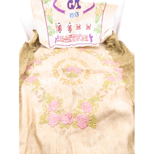 133 - A embroidered silk textiles, early embroidered pieces including a Great War France? example with flo... 