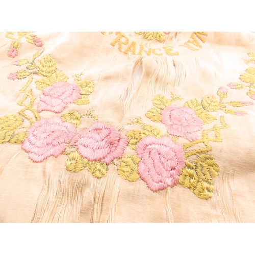 133 - A embroidered silk textiles, early embroidered pieces including a Great War France? example with flo... 