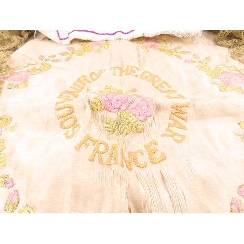 133 - A embroidered silk textiles, early embroidered pieces including a Great War France? example with flo... 