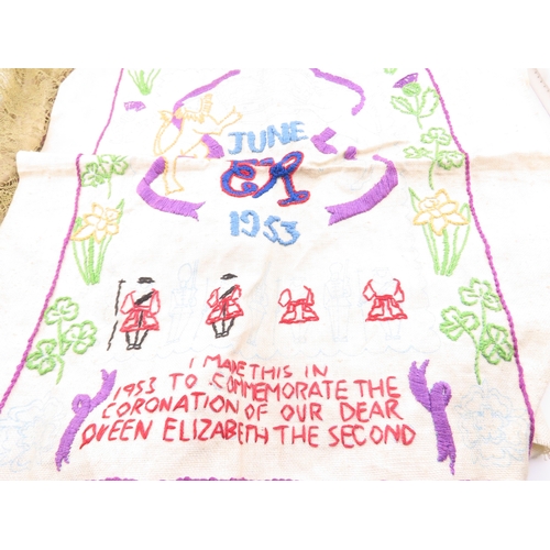 133 - A embroidered silk textiles, early embroidered pieces including a Great War France? example with flo... 