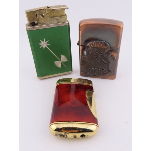 140 - Three vintage lighters, green enamel starburst lighter, copper tone eagle lighter and tortoiseshell ... 
