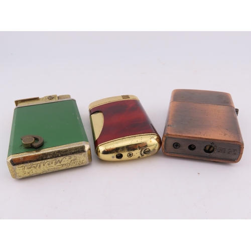 140 - Three vintage lighters, green enamel starburst lighter, copper tone eagle lighter and tortoiseshell ... 