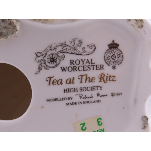 171 - Royal Worcester Tea at the Ritz  blue gown with gilt details and widebrimmed hat.