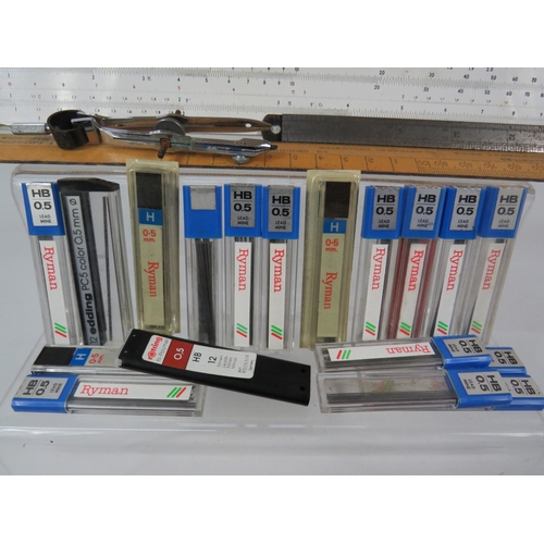 274 - Technical drawing equipment including compasses rulers set squares pencils in red metal case with wo... 