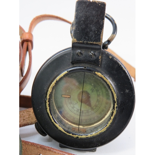276 - Two vintage compasses with leather cases largest approximately 3 inches