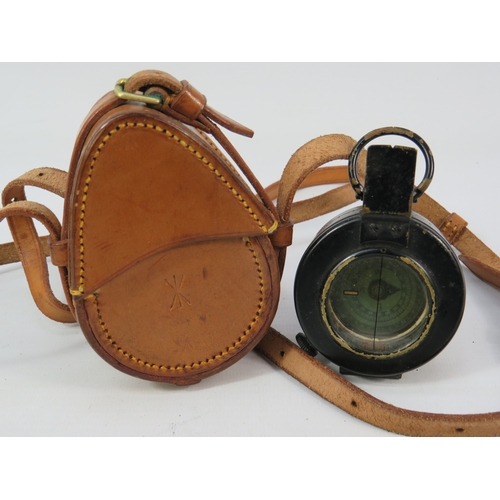 276 - Two vintage compasses with leather cases largest approximately 3 inches