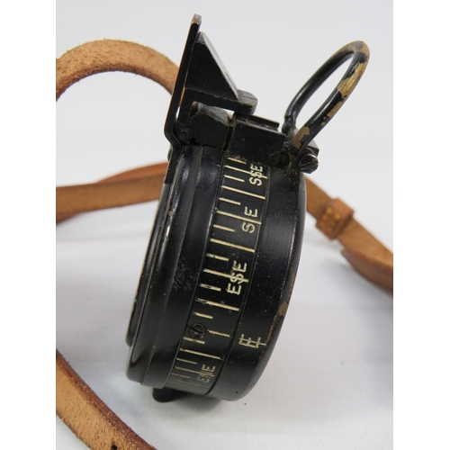 276 - Two vintage compasses with leather cases largest approximately 3 inches