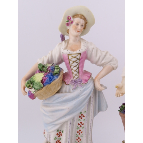 175 - Rudolf Kammer porcelain figures of a vineyard couple, the lady carrying a basket of grapes and the g... 