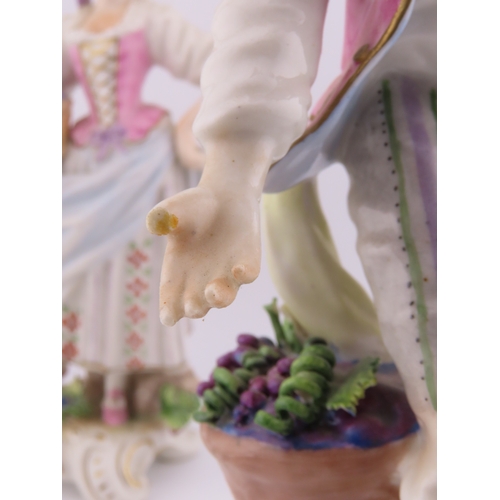175 - Rudolf Kammer porcelain figures of a vineyard couple, the lady carrying a basket of grapes and the g... 