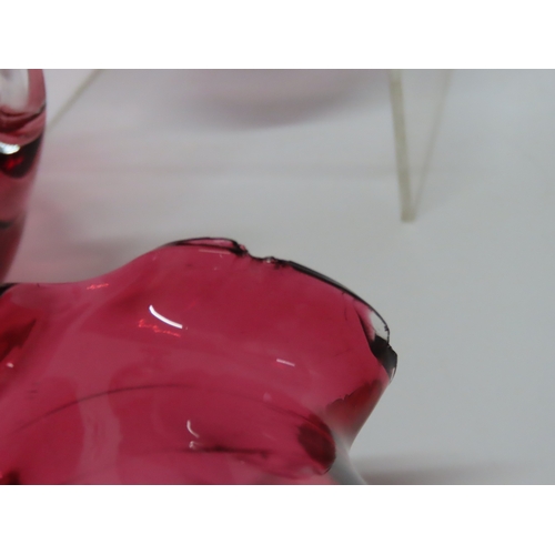 178 - Group of cranberry and ruby tinted glassware including three small cream jugs with clear loop handle... 