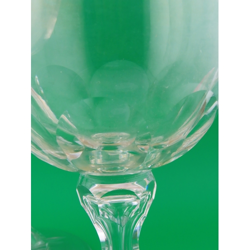 179 - Three large drinking glasses comprising a goblet with shell and scroll engraving, a faceted stem exa... 