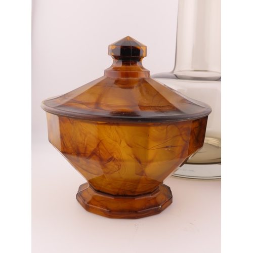 186 - Smoky glass decanter of modern cylindrical form with matching stopper together with two marbled ambe... 