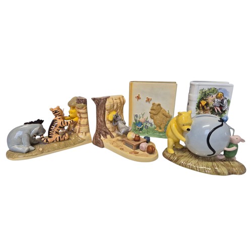 177 - Collection of Winnie the Pooh porcelain and ceramic figures and bookends, including table group scen... 