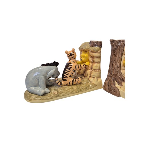 177 - Collection of Winnie the Pooh porcelain and ceramic figures and bookends, including table group scen... 