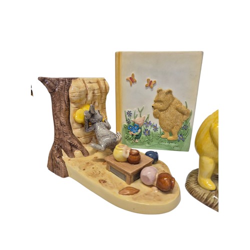 177 - Collection of Winnie the Pooh porcelain and ceramic figures and bookends, including table group scen... 