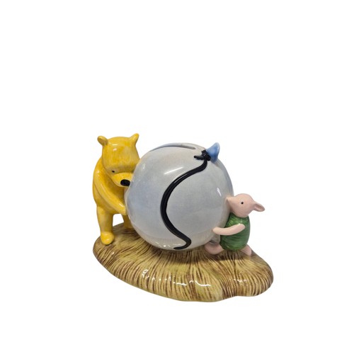 177 - Collection of Winnie the Pooh porcelain and ceramic figures and bookends, including table group scen... 