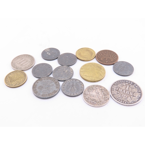 296 - A small selection of German coins dating from 1875 to the 1940s, including mixed denominations.
