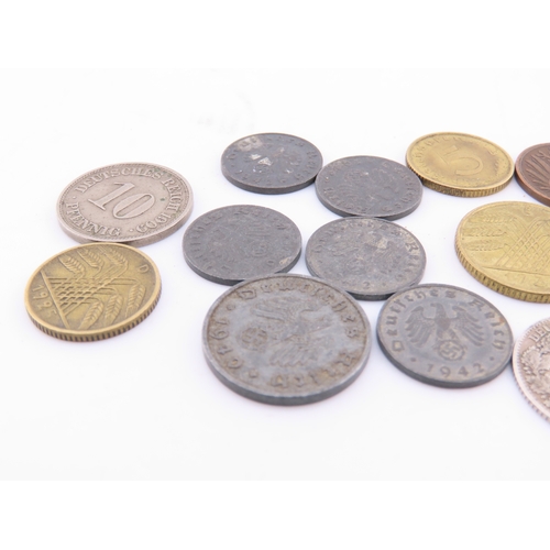296 - A small selection of German coins dating from 1875 to the 1940s, including mixed denominations.