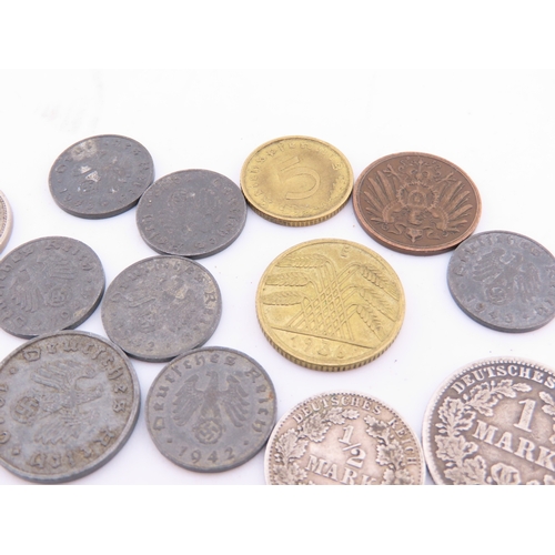 296 - A small selection of German coins dating from 1875 to the 1940s, including mixed denominations.