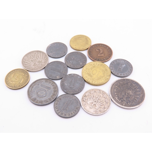 296 - A small selection of German coins dating from 1875 to the 1940s, including mixed denominations.