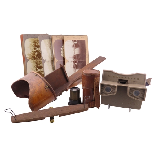 308 - A mixed collection of early photographic accessories comprising leather cylindrical cases, a leather... 