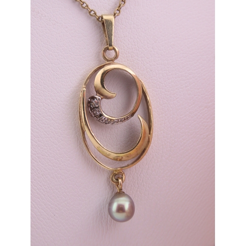 333 - A 9 carat gold diamond and pearl pendant necklace the pendant designed with a pearl drop and diamond... 