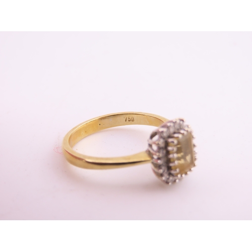 125 - An 18ct yellow gold ring claw set with a rectangular cut citrine accented by small brilliant cut dia... 