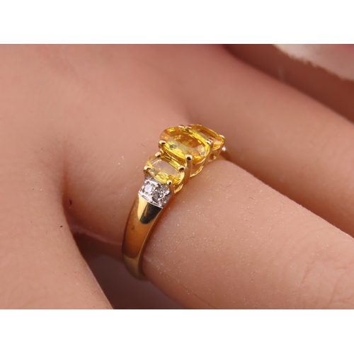 144 - A 9ct gold ring set with a citrine accented by small diamonds. Ring size M. Gross weight 1.9 grams.