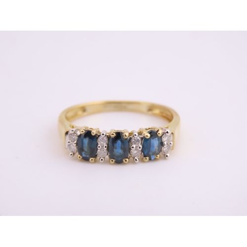 145 - A 9ct gold ring set with alternating sapphires and diamonds. Ring size M. Gross weight 1.7 grams.