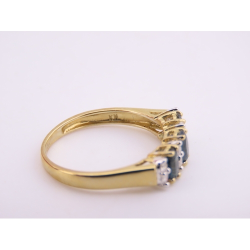 145 - A 9ct gold ring set with alternating sapphires and diamonds. Ring size M. Gross weight 1.7 grams.