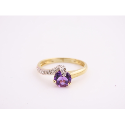 151 - 9ct Gold Amethyst and Diamond Ring. A delicate 9ct gold ring set with a round cut amethyst accented ... 