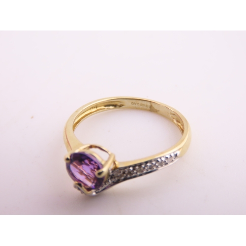 151 - 9ct Gold Amethyst and Diamond Ring. A delicate 9ct gold ring set with a round cut amethyst accented ... 