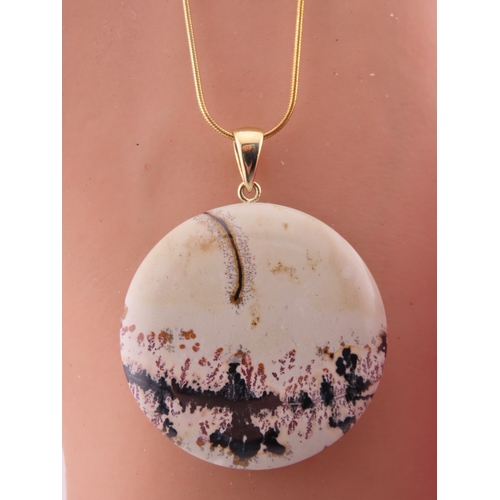 166 - 9ct Gold Dendritic Agate Pendant Necklace. A 9ct gold pendant set with a dendritic agate plaque disp... 
