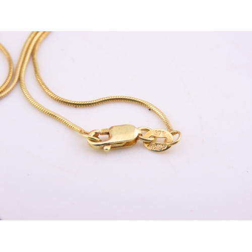 166 - 9ct Gold Dendritic Agate Pendant Necklace. A 9ct gold pendant set with a dendritic agate plaque disp... 