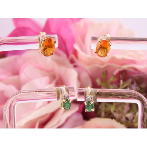 176 - Two Pairs of 9ct Gold Earrings. One pair set with fire opals and the other with emeralds both fitted... 