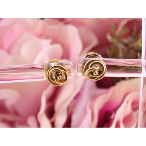 177 - Two Pairs of 18ct Gold Earrings. One pair of swirl design and the other of polished knot form both w... 