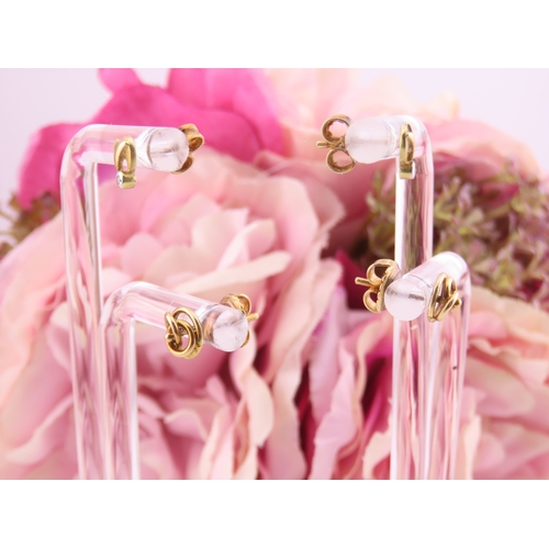 177 - Two Pairs of 18ct Gold Earrings. One pair of swirl design and the other of polished knot form both w... 