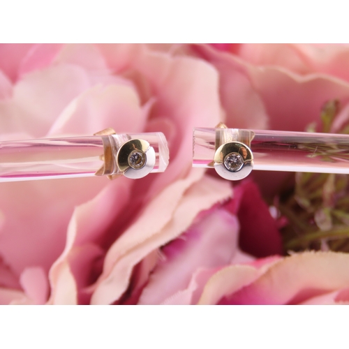 179 - Pair of 14ct Two Tone Gold Diamond Set Earrings. Each centred with a small brilliant cut diamond in ... 
