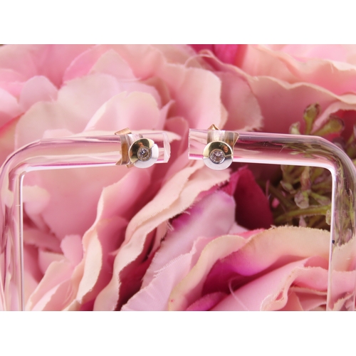 179 - Pair of 14ct Two Tone Gold Diamond Set Earrings. Each centred with a small brilliant cut diamond in ... 