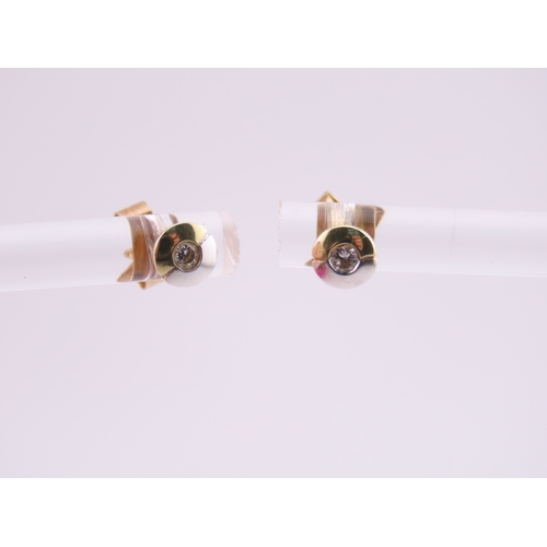 179 - Pair of 14ct Two Tone Gold Diamond Set Earrings. Each centred with a small brilliant cut diamond in ... 