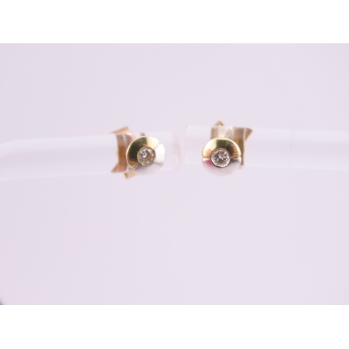 179 - Pair of 14ct Two Tone Gold Diamond Set Earrings. Each centred with a small brilliant cut diamond in ... 
