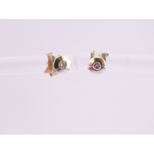 179 - Pair of 14ct Two Tone Gold Diamond Set Earrings. Each centred with a small brilliant cut diamond in ... 